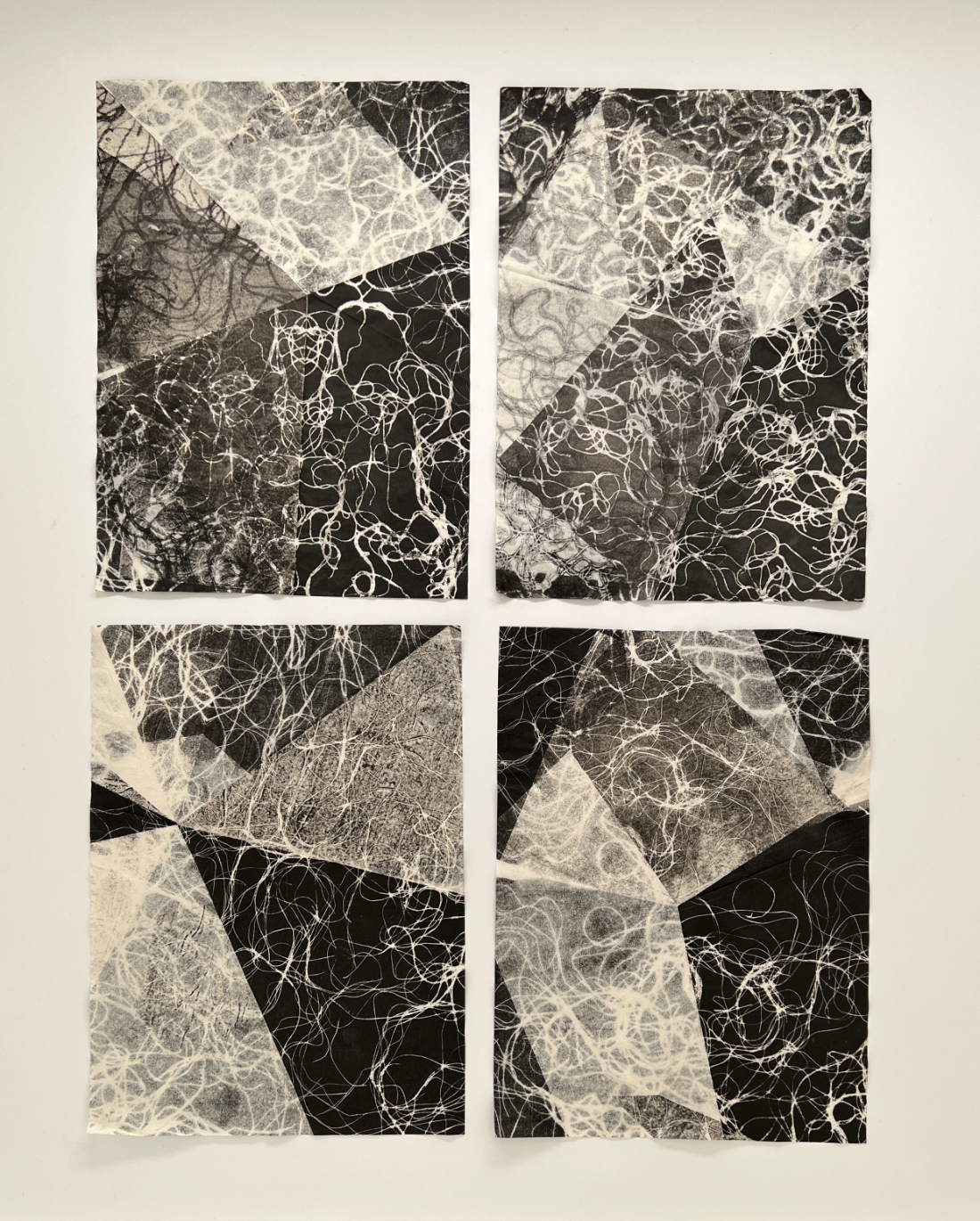 four textured monotype prints of coiled threads arranged to look like window panes