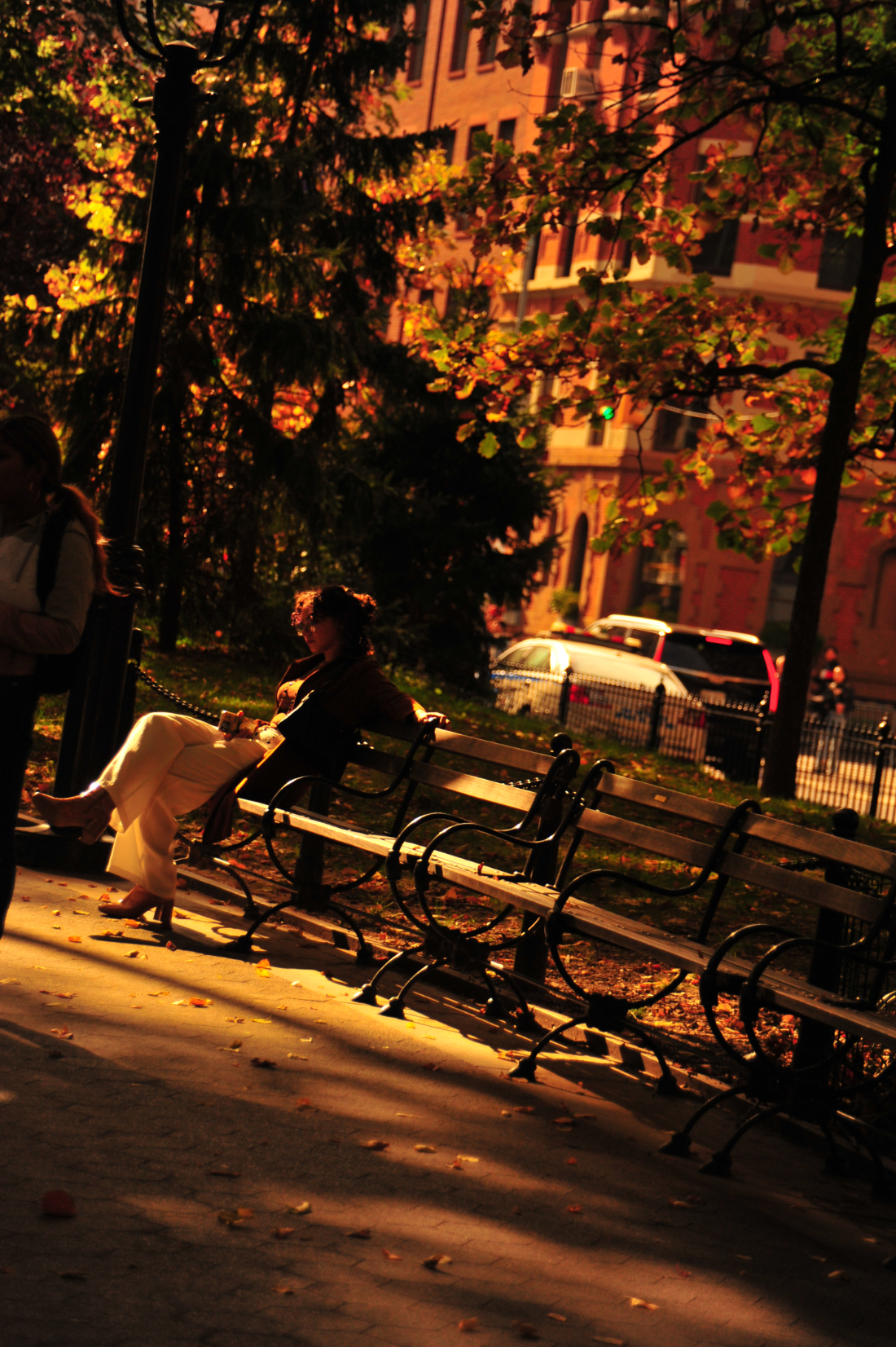 slanted view of woman on a bench in a park