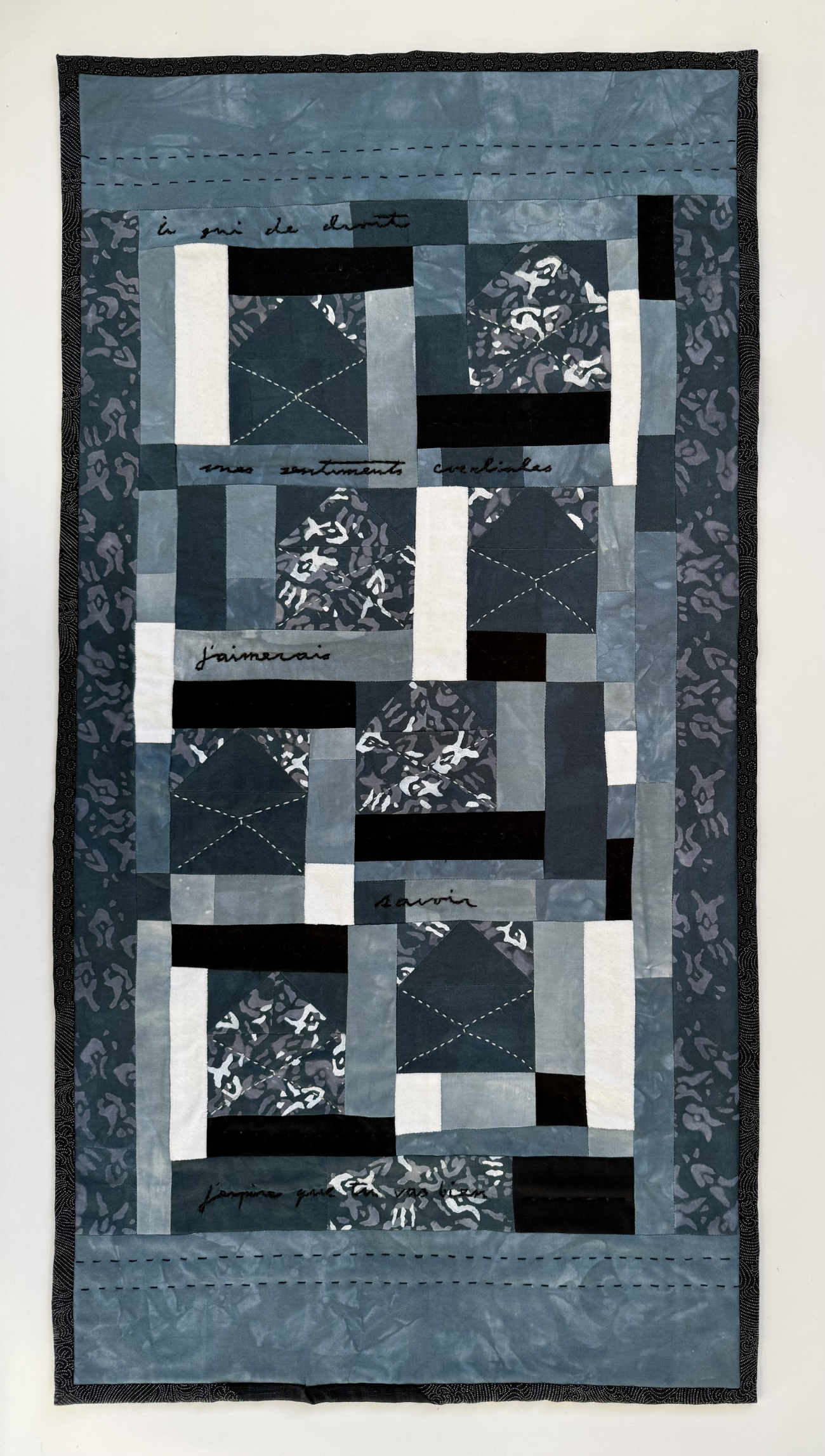 quilt with pieces resembling open envelopes