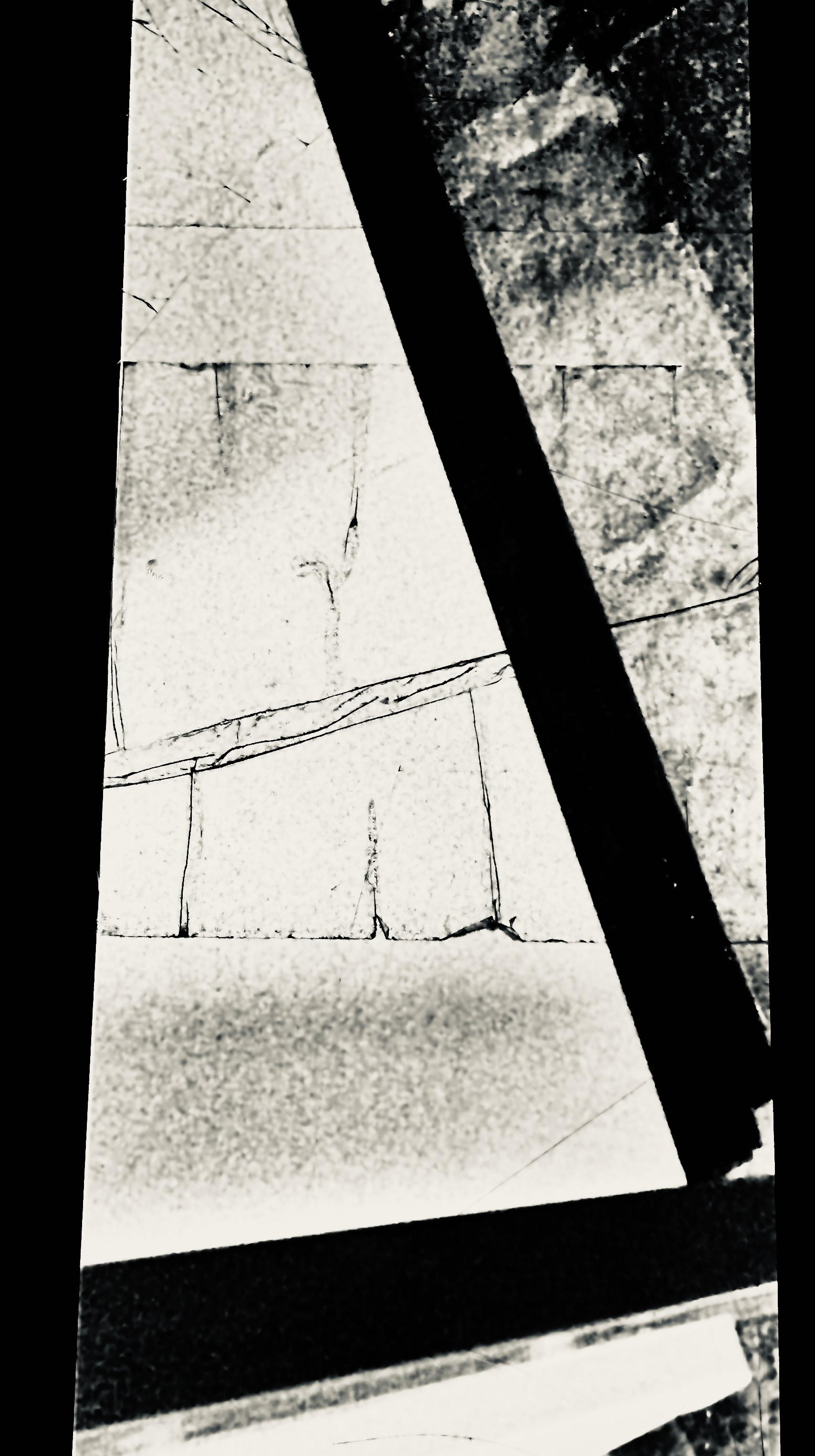 abstract walllike textures and triangular shadow frame just off center